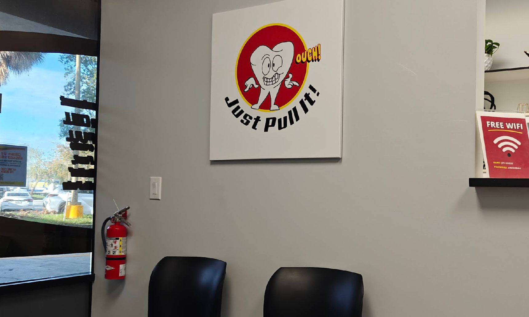 Just Pull It Tampa waiting room with mascot artwork