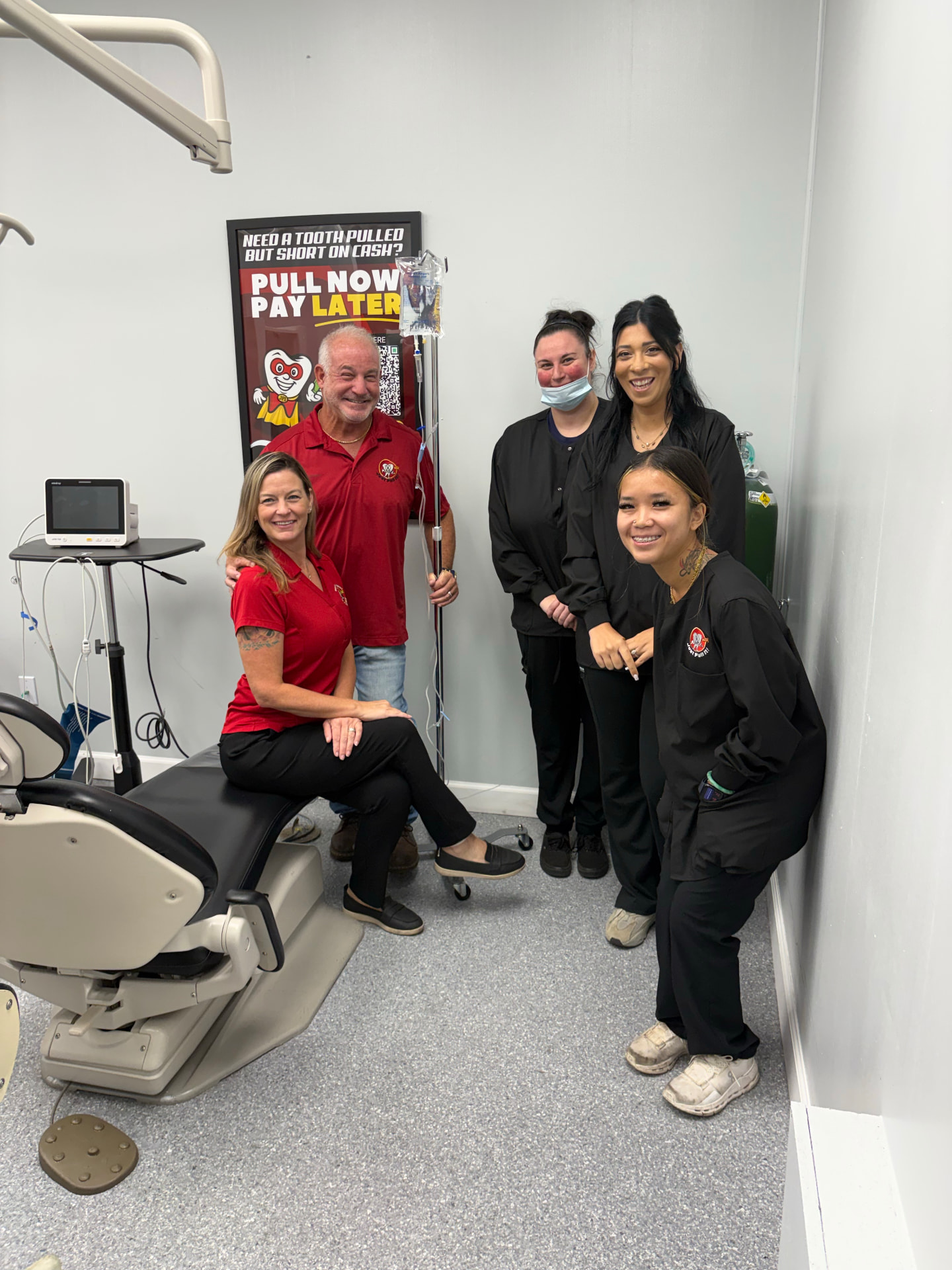 Just Pull It Tampa team with a patient inside a treatment room
