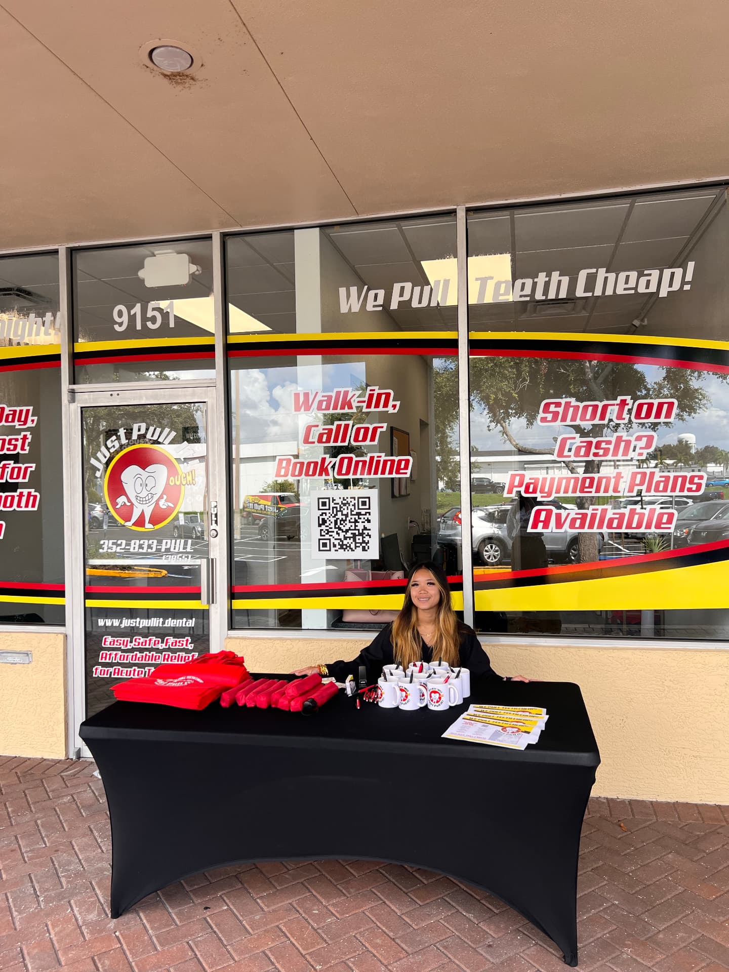 Just Pull It Pinellas Park team member welcoming visitors outside the office
