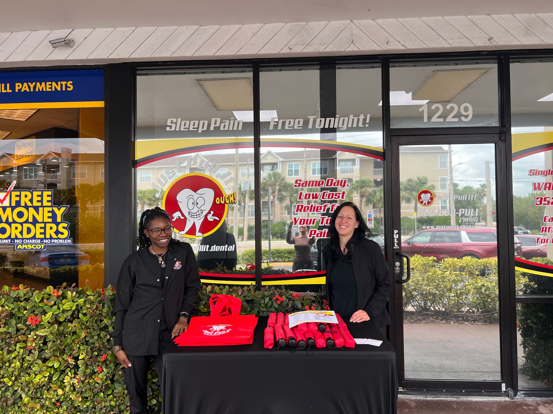 Just Pull It Clearwater team welcoming patients outside the office