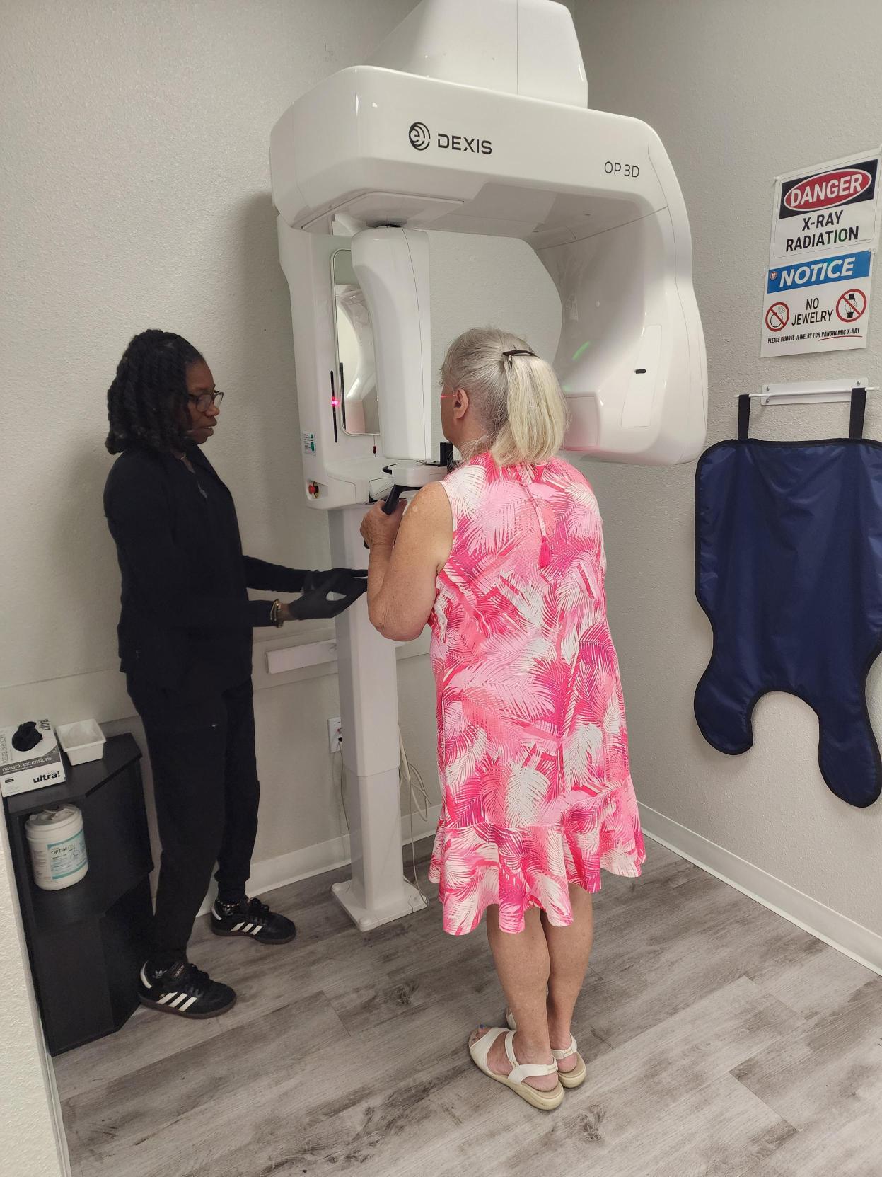 Patient receiving a panoramic dental X-ray at the Just Pull It Clearwater office