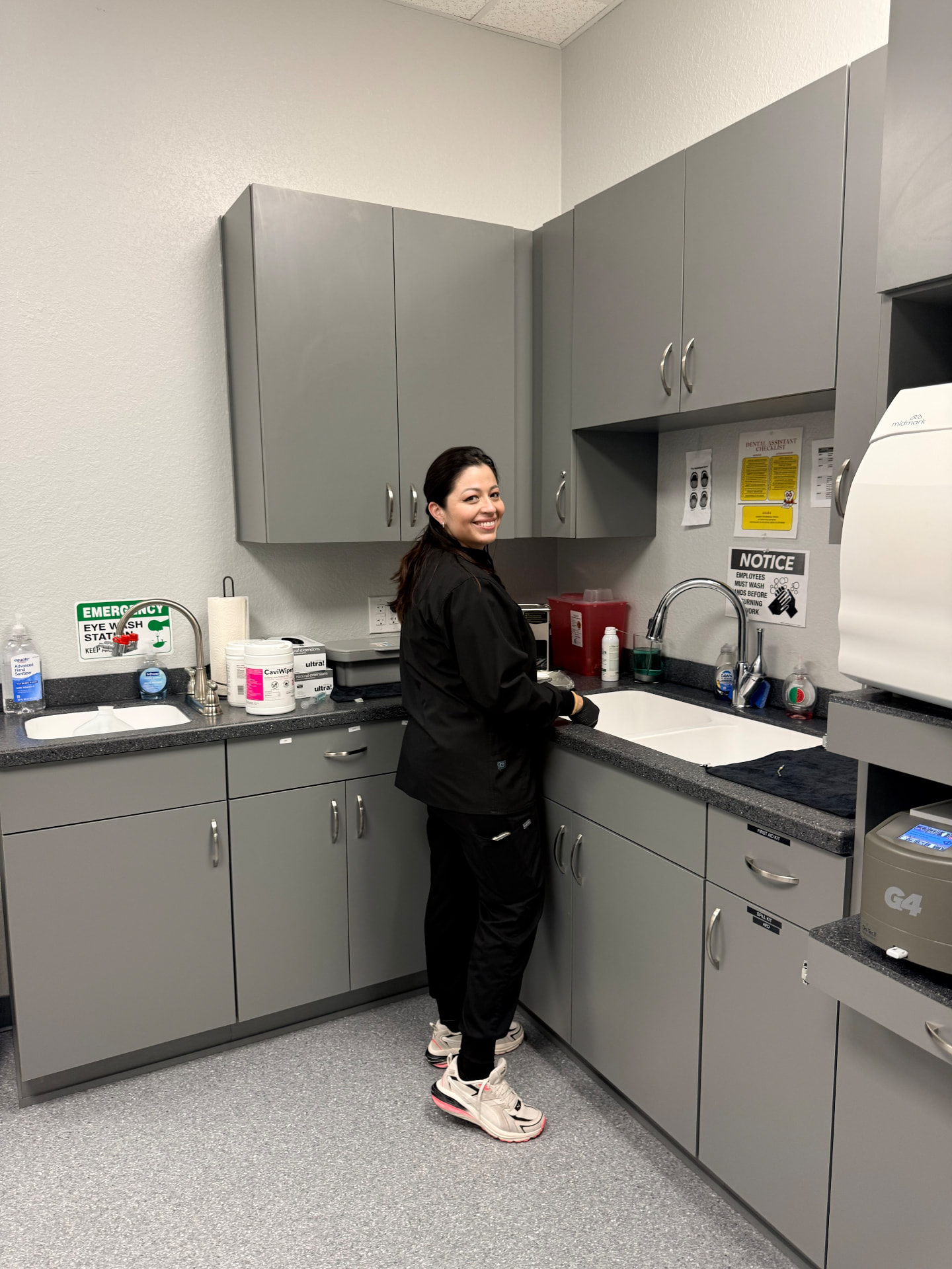 Staff member in the sterilization area at the Just Pull It Port Richey office